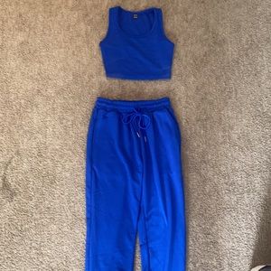 Royal blue cropped tank with sweatpants.